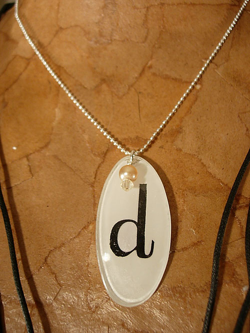 Monogrammed jewelry made using eyeglasses